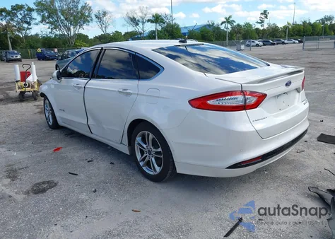 2015 Ford Fusion Hybrid Titanium из США, поврежденный, VIN 3FA6P0RU8FR123653